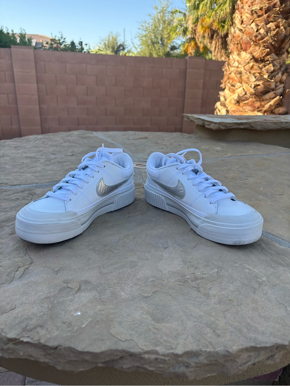 Women’s Nike Court Legacy Lift Platform White Sneakers with Silver Swoosh Accent